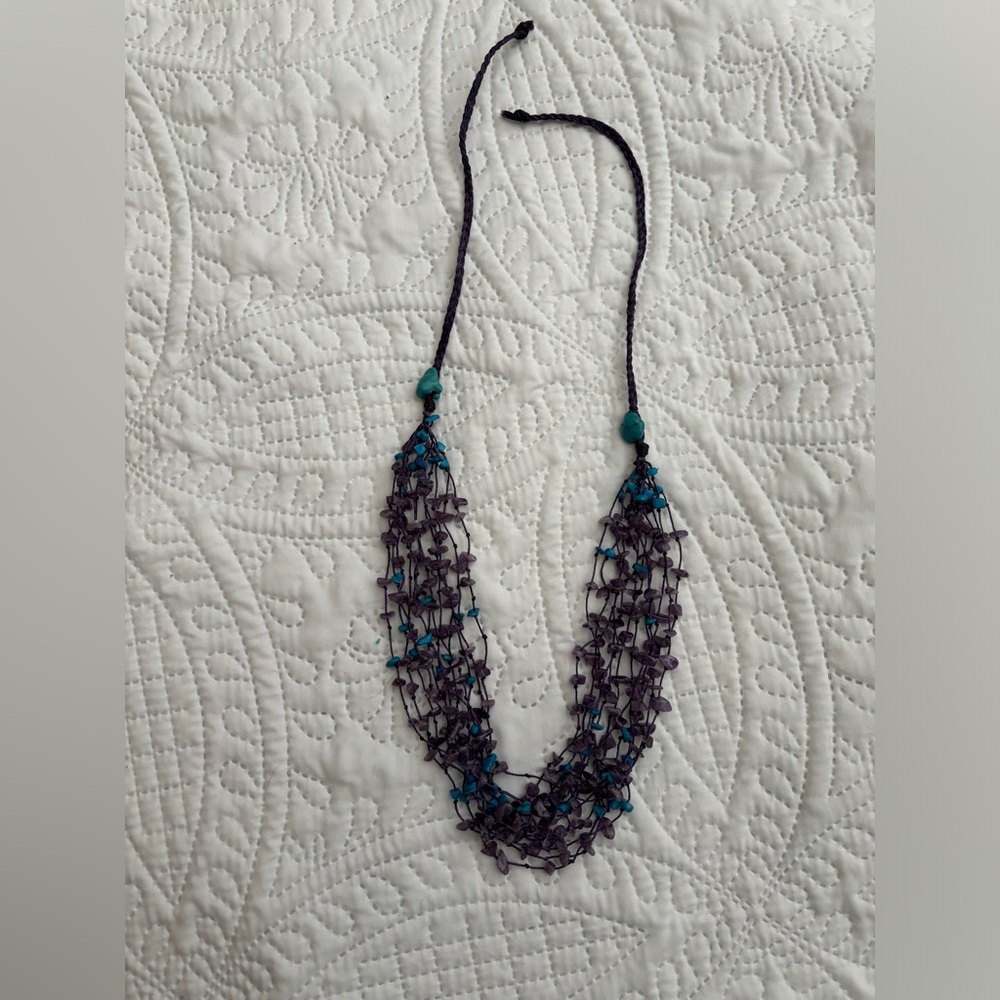 Turquoise and purple beaded multi strand necklace.